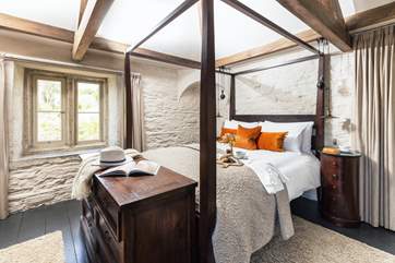Dreamy oak beamed bedroom 3 with four-poster bed and beautiful furniture.