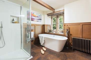 The en suite bathroom to bedroom 3 has a super walk-in shower and free-standing roll top bath.