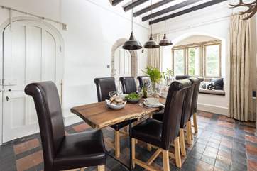 The elegant dining-area with feature oak table is the perfect place to gather the family and chat about the day ahead.