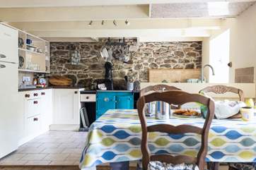Exposed stonework and beams give a nod to the character of the cottage.