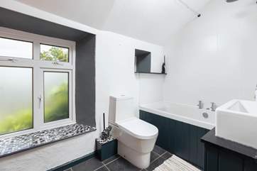 The lovely bathroom fills with natural light.