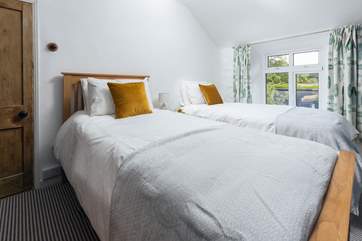 The twin bedroom has luxury bedding and is light and airy (Bedroom 2).