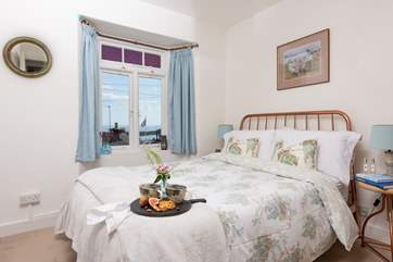 The very pretty main bedroom has a sea view.