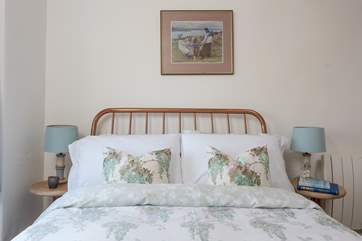 Gorgeous linens await in the double bedroom.