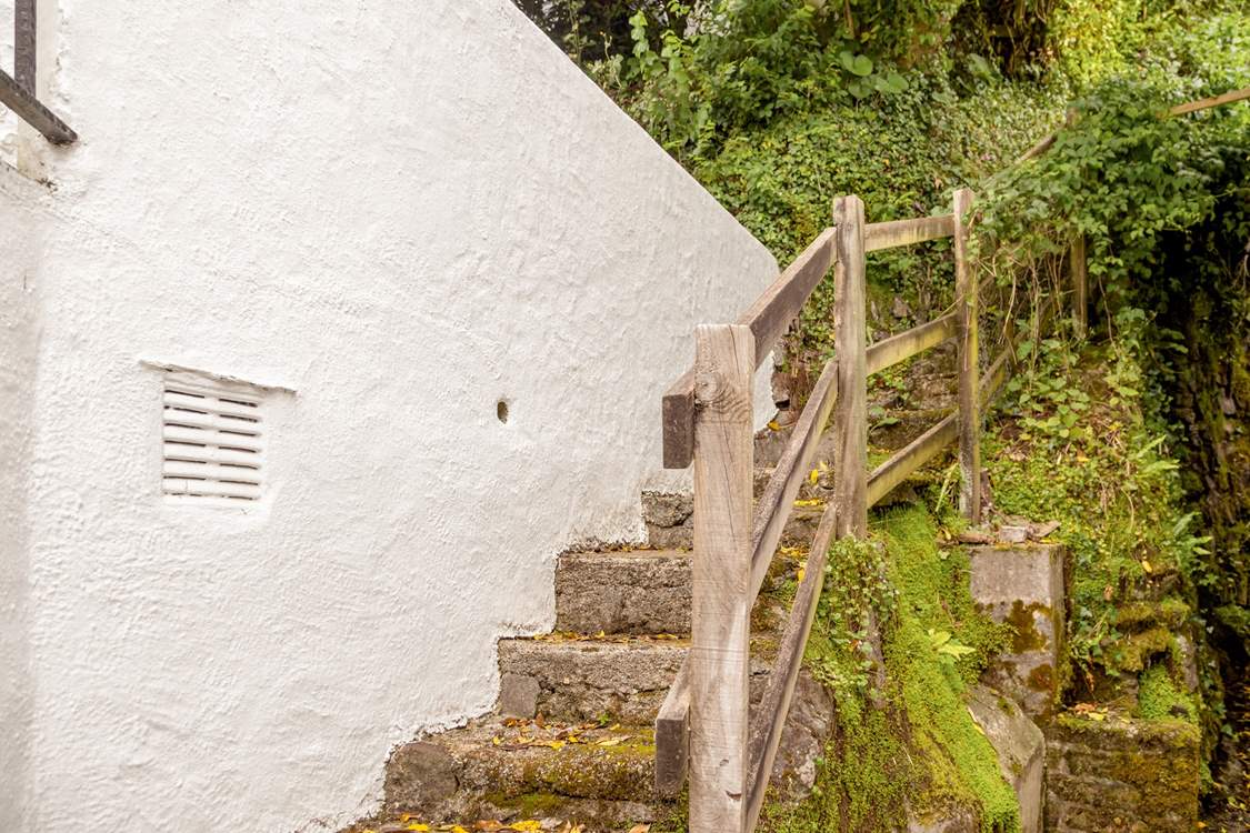 The steps to the garden are to the left of the cottage, it is certainly worth the climb.
