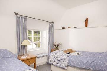 This little twin bedroom has a lovely snug feeling to it.
