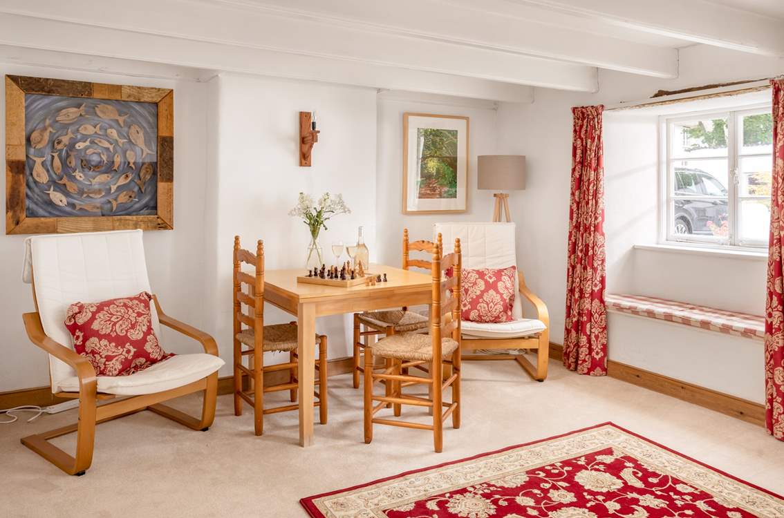The sitting-room has a table and chairs which is perfect for a game of chess perhaps or to plan the next day's adventures.