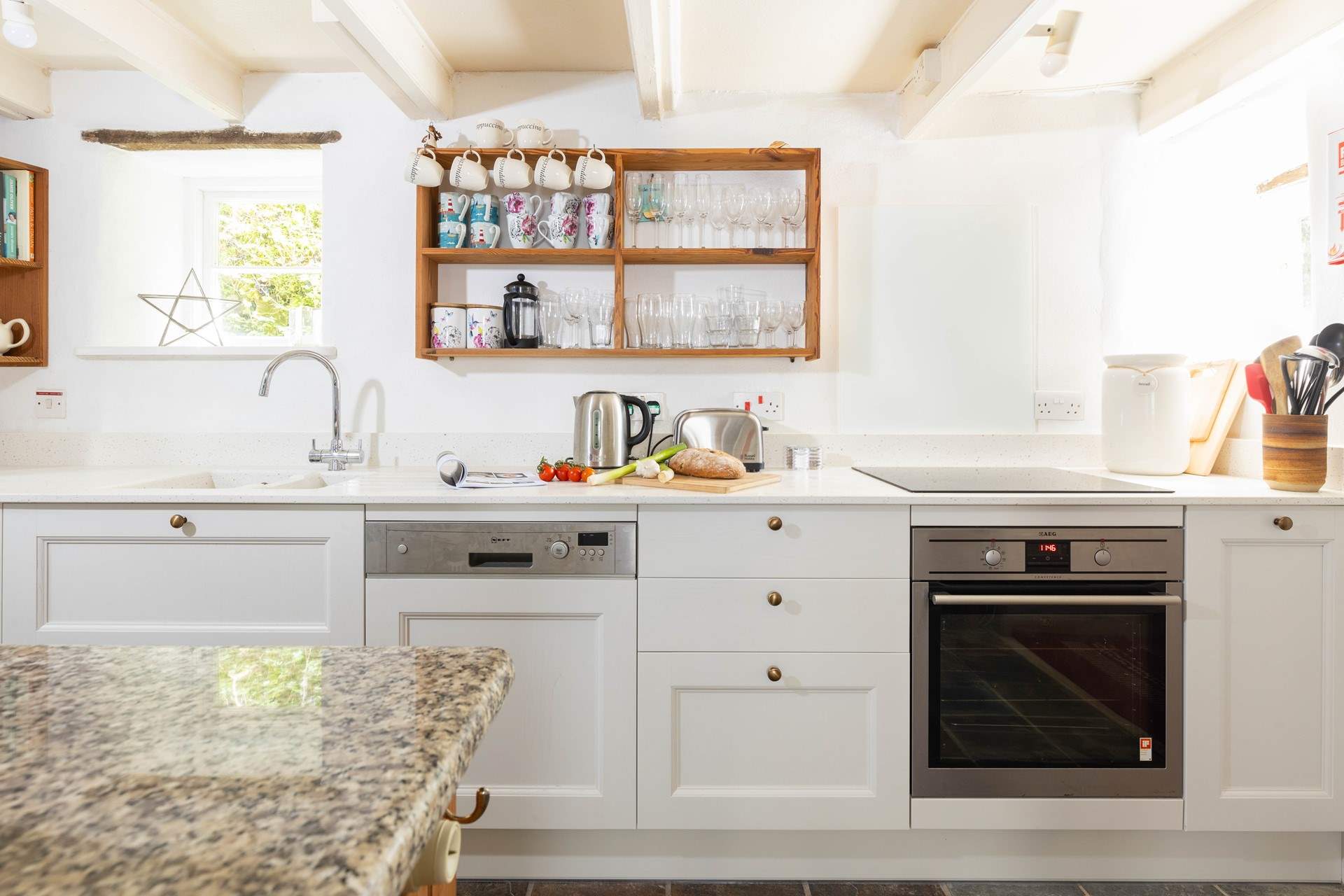 The lovely kitchen is both stylish and well-equipped.