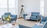 Relax in the sitting-area of the open plan first floor. - Thumbnail Image