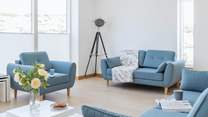Relax in the sitting-area of the open plan first floor.
