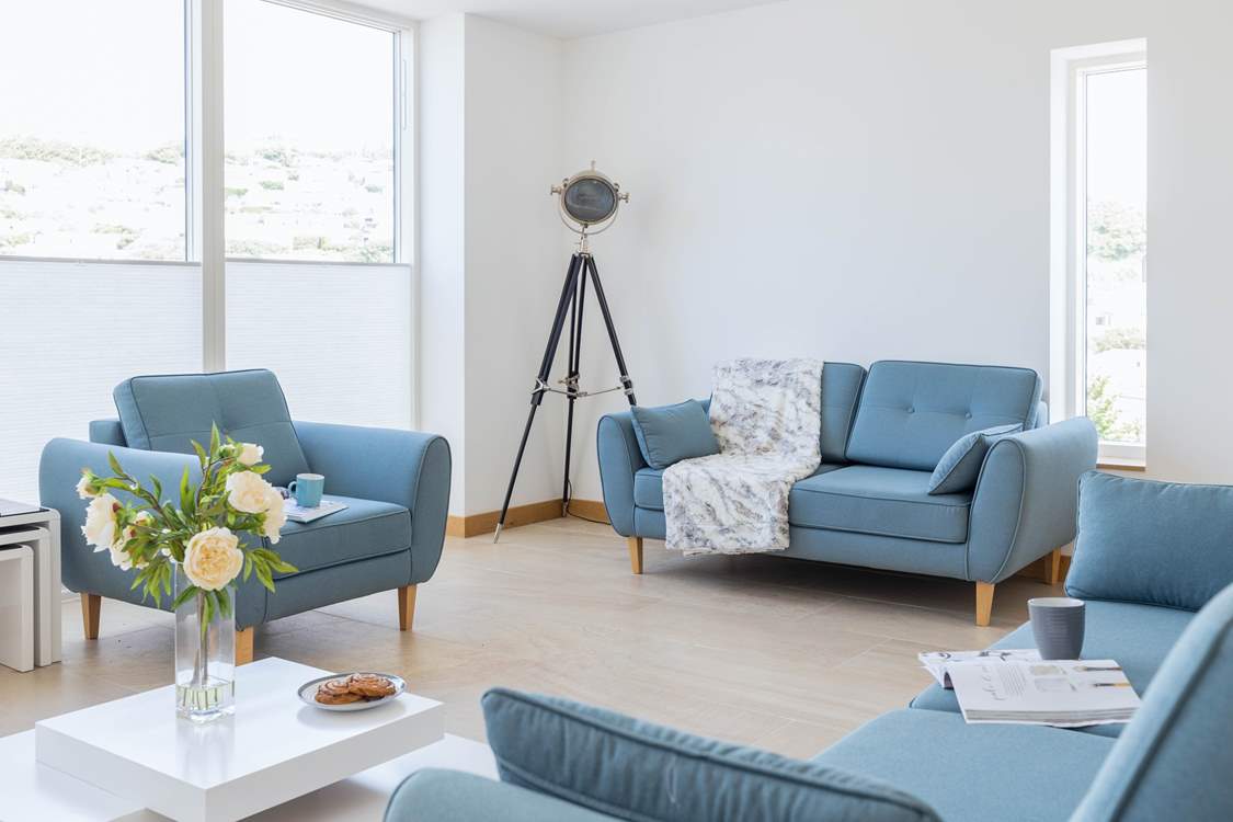 Relax in the sitting-area of the open plan first floor.