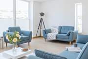 Relax in the sitting-area of the open plan first floor.