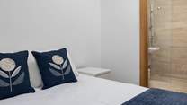 Bedroom one has a fabulous en suite shower-room and luxury bedding.