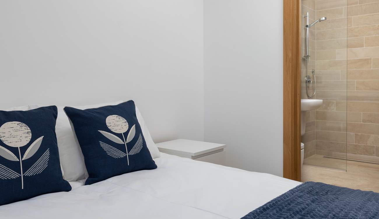 Bedroom one has a fabulous en suite shower-room and luxury bedding.