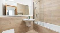 The family bathroom, perfect for a long soak after a day on the beach.