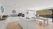 The super sleek kitchen is ideal for sociable times.