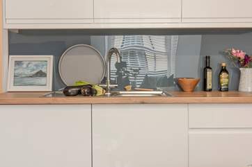 The kitchen is well-equipped and has ample storage space.
