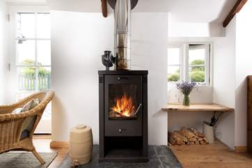 The sitting-area is flooded with light and has a comfy sofa and preloved rocking chair basking in the toasty warmth of the wood-burner so you can stretch out after a day walking the coastal footpaths or exploring the many art galleries in west Cornwall.