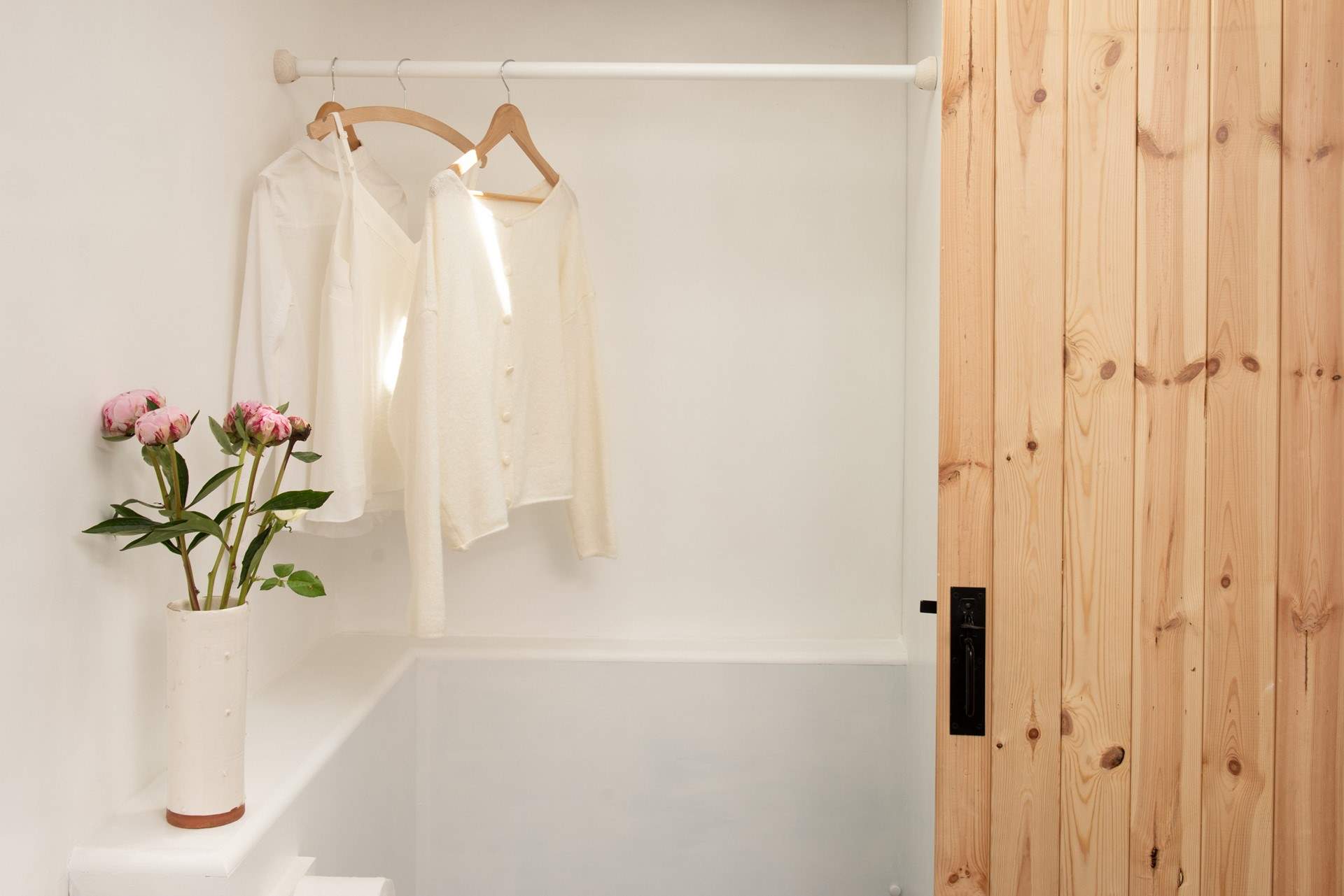 There is plenty of hanging space in the shower-room.