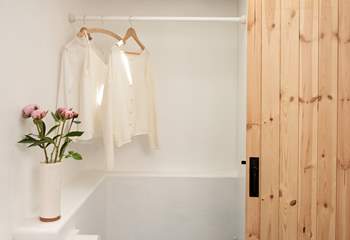 There is plenty of hanging space in the shower-room.