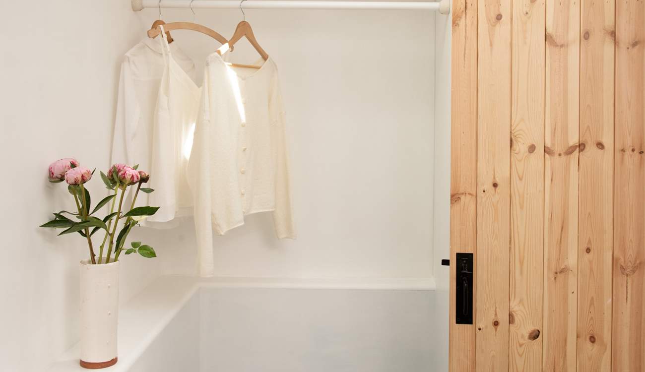 There is plenty of hanging space in the shower-room.