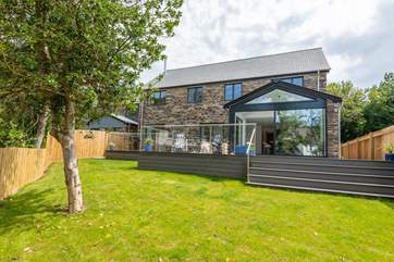 The enclosed garden is perfect letting the children and dogs run free while you enjoy a glass of wine on the decking.