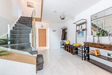 The hallway and staircase leading up to the bedrooms.
