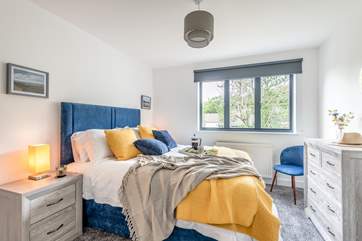 Bedroom two has a comfortable king-size bed.