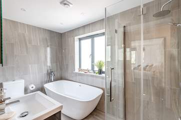 The family bathroom has a bath and separate waterfall shower.