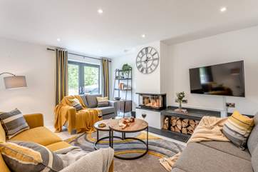 The contemporary wood-burner makes the living space a cosy area during those cooler months.