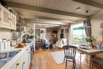 The beautiful open plan living space. With light and airy interiors, large double doors and cosy sitting areas, this really is the idyllic country escape.