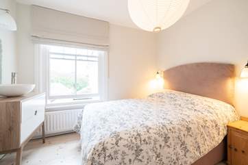The comfortable third bedroom on the first floor.