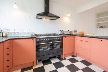 The well-equipped open plan kitchen is ideal to cook up a popular family favourite.