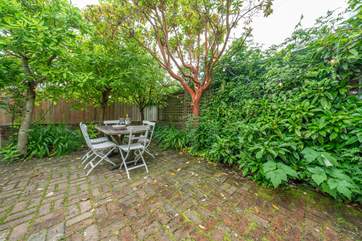 The rear patio area has fairy lights which look magical under the stars at night.