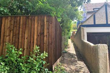 There is a path off Gully Road which leads to the back of the Hillside.