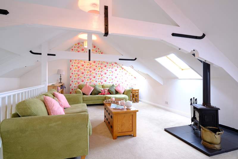 This wonderful property is reverse level to make the most of the space, so this fabulous sitting-room is on the top level above the kitchen/diner with the bedrooms on the lower ground floor.