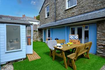 Sit in the sun or a shady spot in the summer-house.