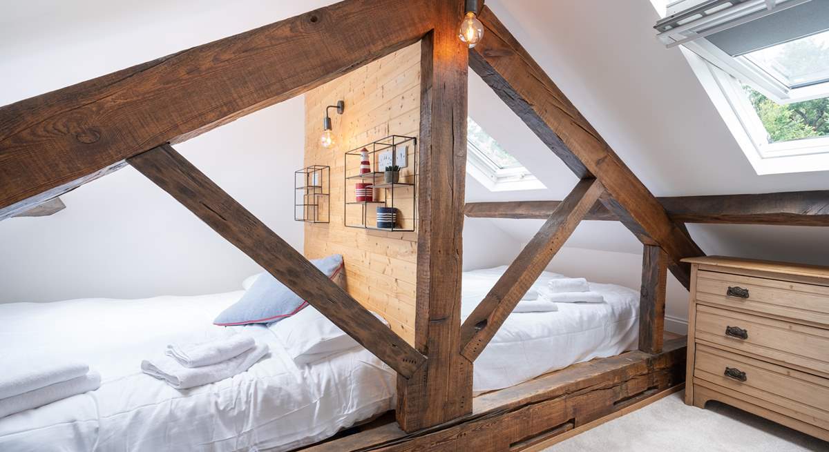 The third bedroom on the second floor is the perfect place for the younger ones for a good night's sleep.