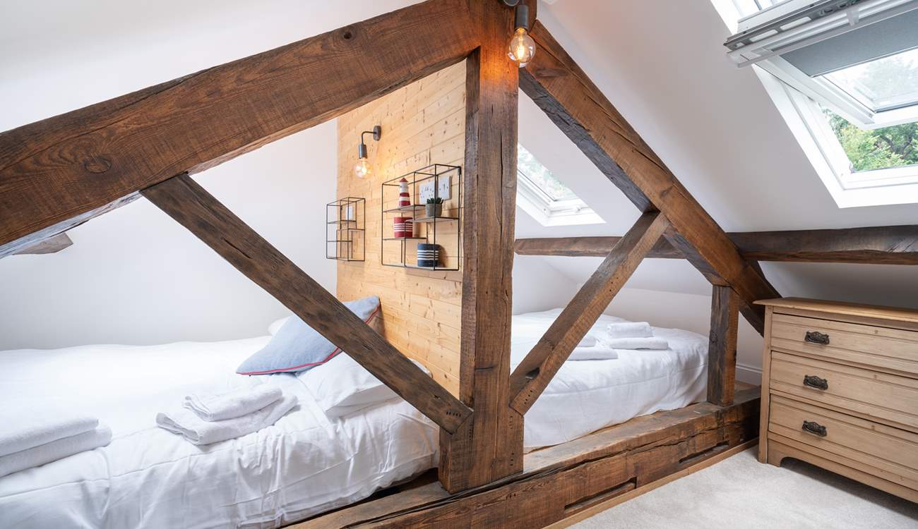 The third bedroom on the second floor is the perfect place for the younger ones for a good night's sleep.