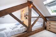 The third bedroom on the second floor is the perfect place for the younger ones for a good night's sleep.