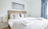 The comfortable main bedroom on the first floor offers plenty of space. - Thumbnail Image