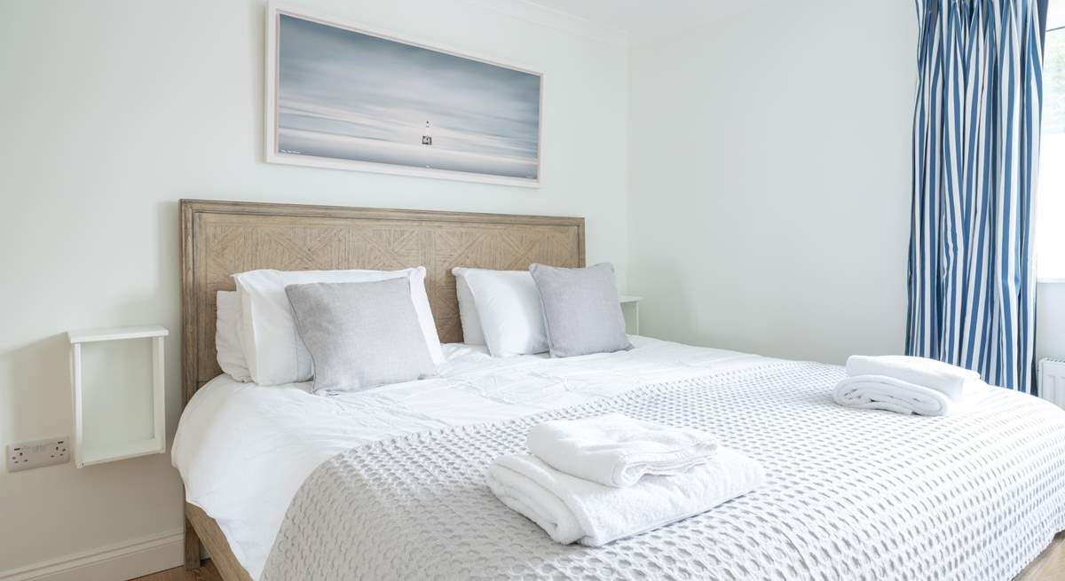 The comfortable main bedroom on the first floor offers plenty of space.