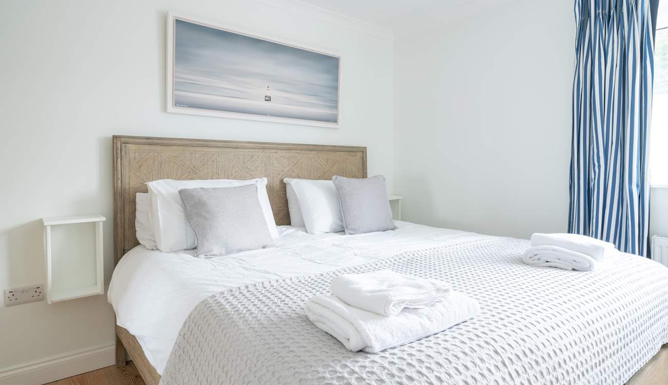 The comfortable main bedroom on the first floor offers plenty of space.