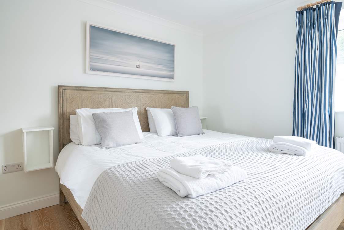 The comfortable main bedroom on the first floor offers plenty of space.