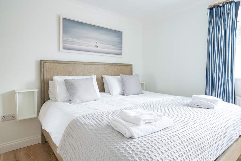 The comfortable main bedroom on the first floor offers plenty of space.