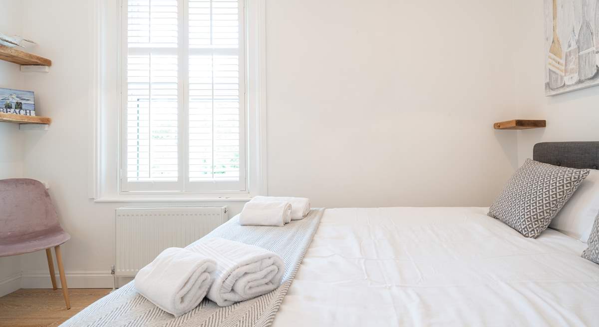 The light and airy second bedroom on the first floor.