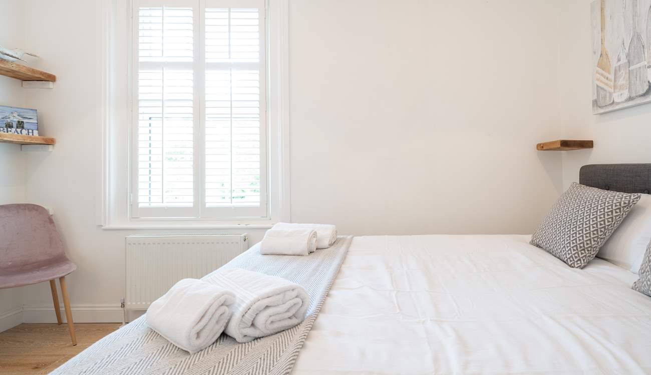 The light and airy second bedroom on the first floor.