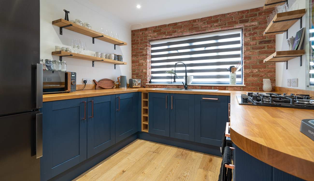 Cook up a family favourite in this modern stylish open plan kitchen.