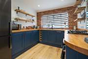 Cook up a family favourite in this modern stylish open plan kitchen.