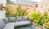 The patio area has a Mediterranean feel and is a real sun-trap in the summer months.  - Thumbnail Image